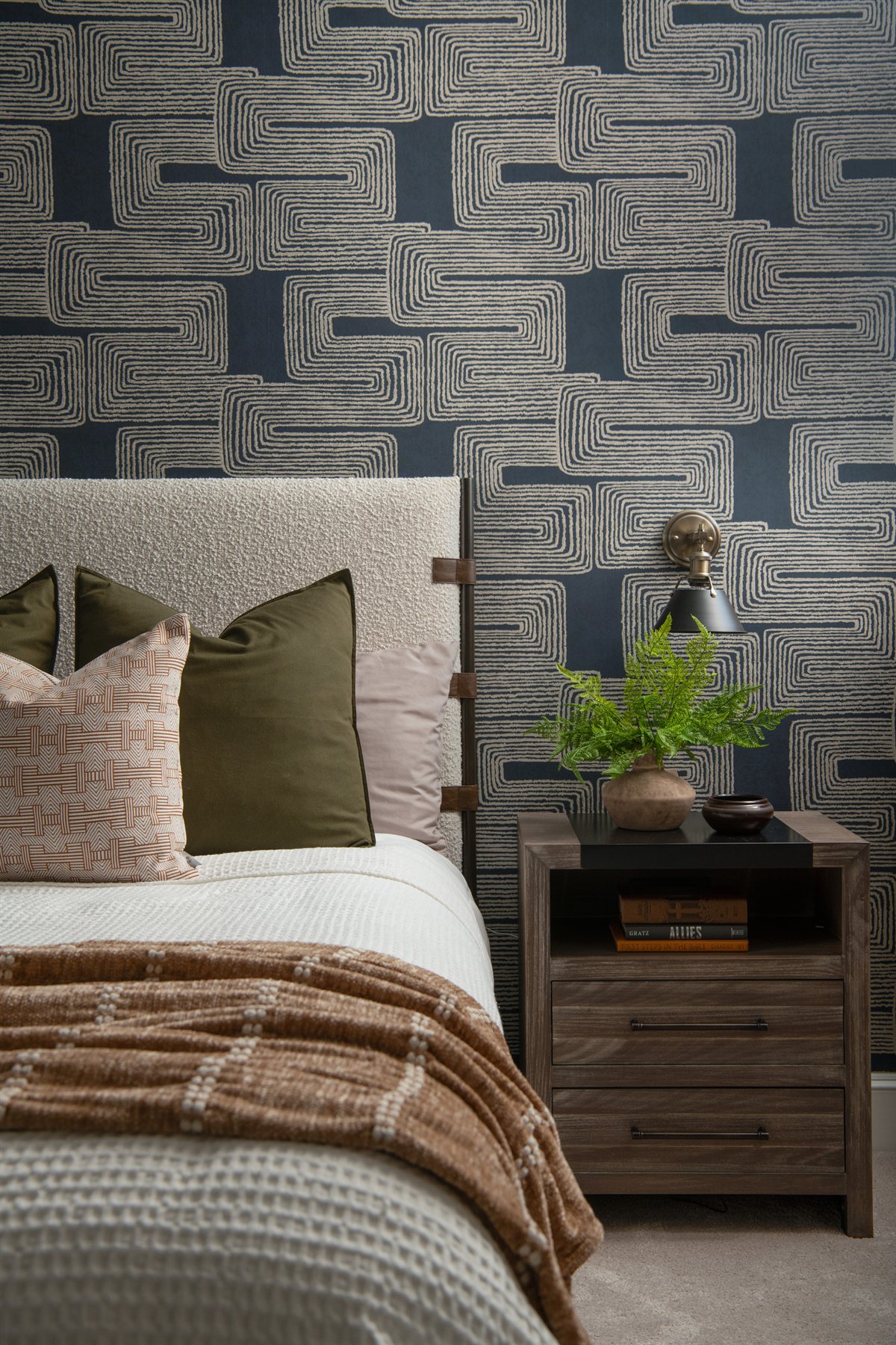 Guest bed with plaid bedding against patterned wallpaper, Valencia Terrace renovation