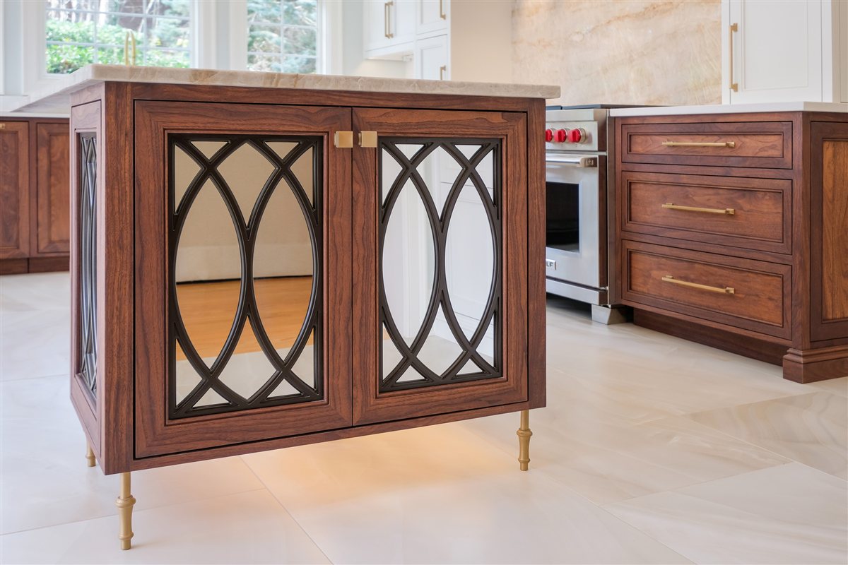 Island end with arched glass cabinet doors and brass legs, Waxhaw kitchen