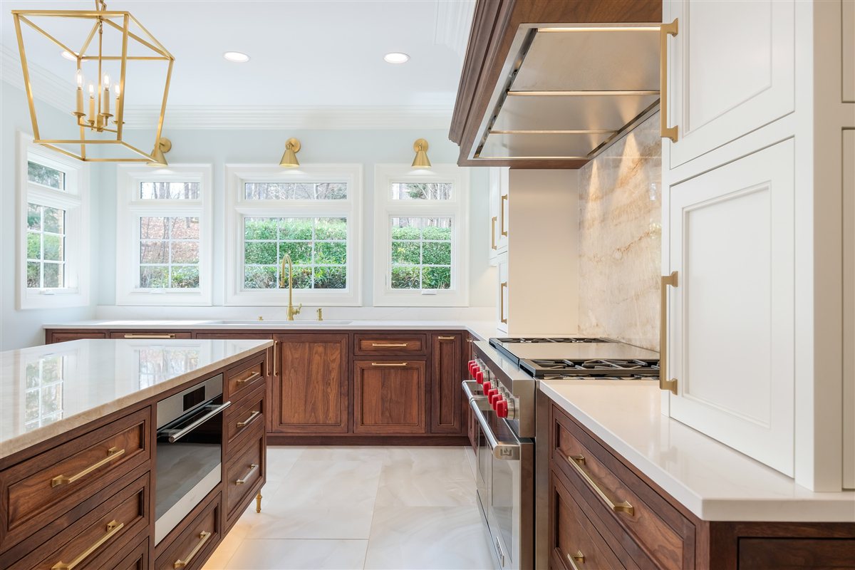 Kitchen with walnut cabinets, a stainless hood and windows, Waxhaw kitchen