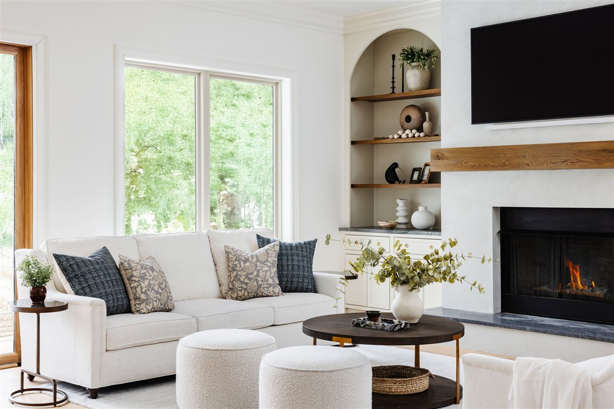 Family room with a wood mantel and arched shelving, Waxhaw renovation