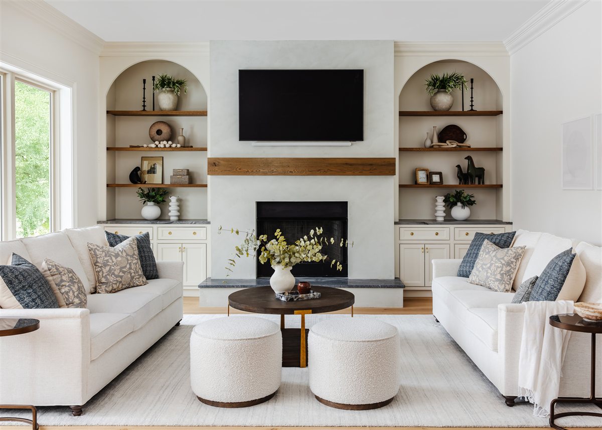 Family room with a white sectional facing the fireplace, Waxhaw renovation