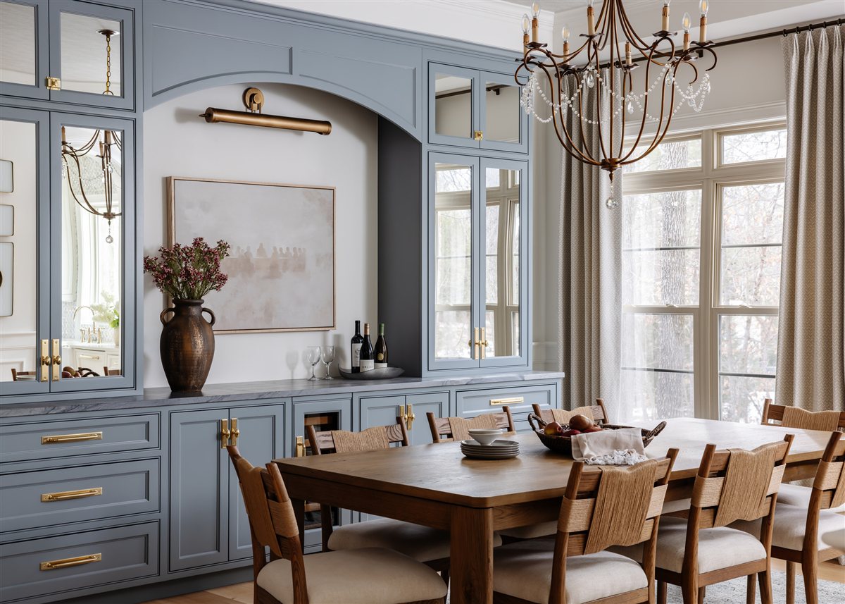 Blue built-in buffet with an art light in the dining room, Waxhaw renovation