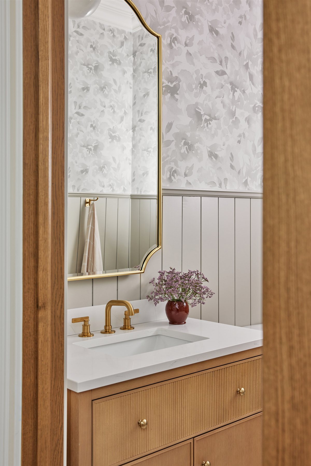 Wood vanity and brass faucet in the powder room, Waxhaw renovation