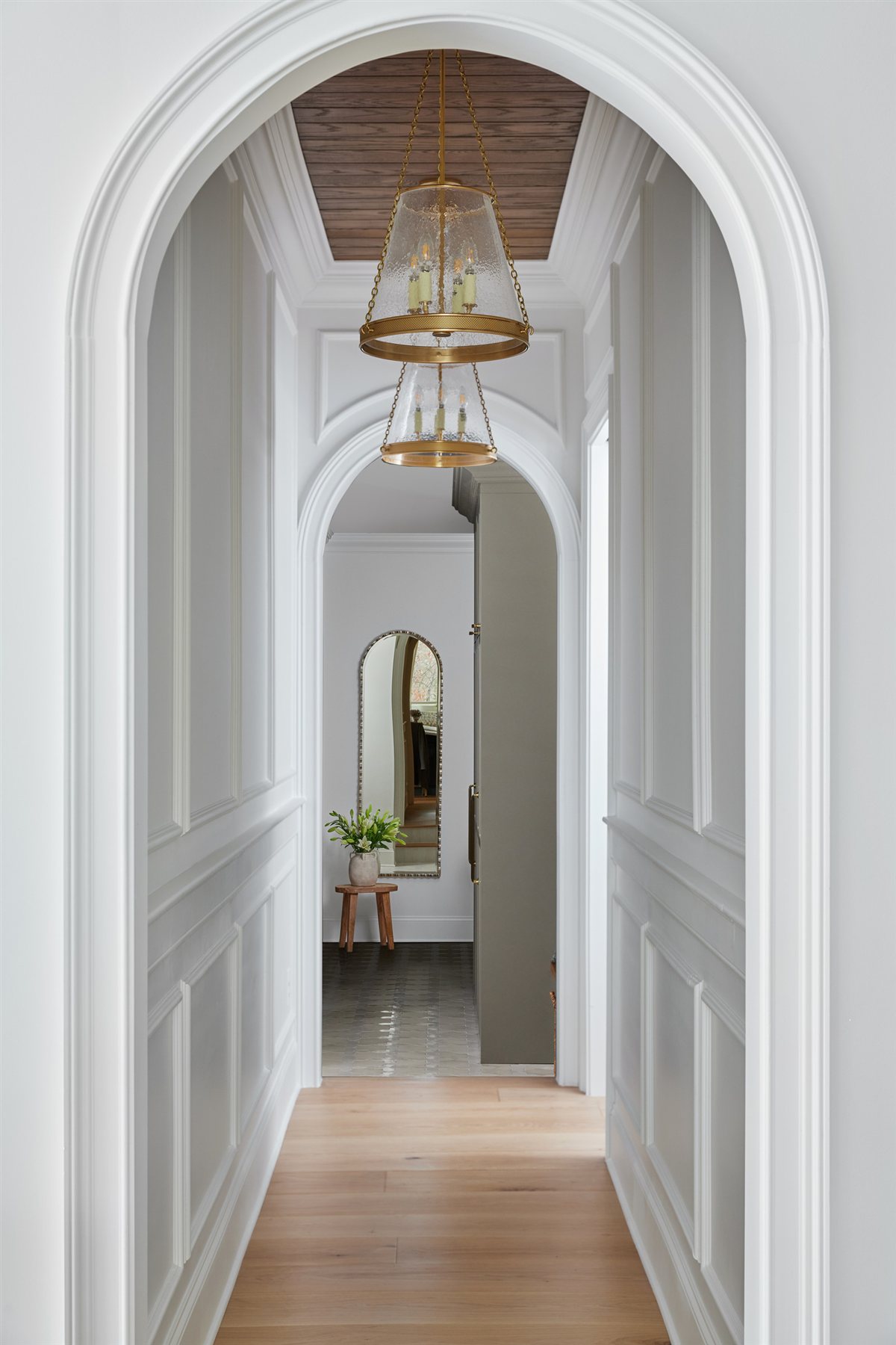 Arched hallway with a lantern light, Waxhaw renovation