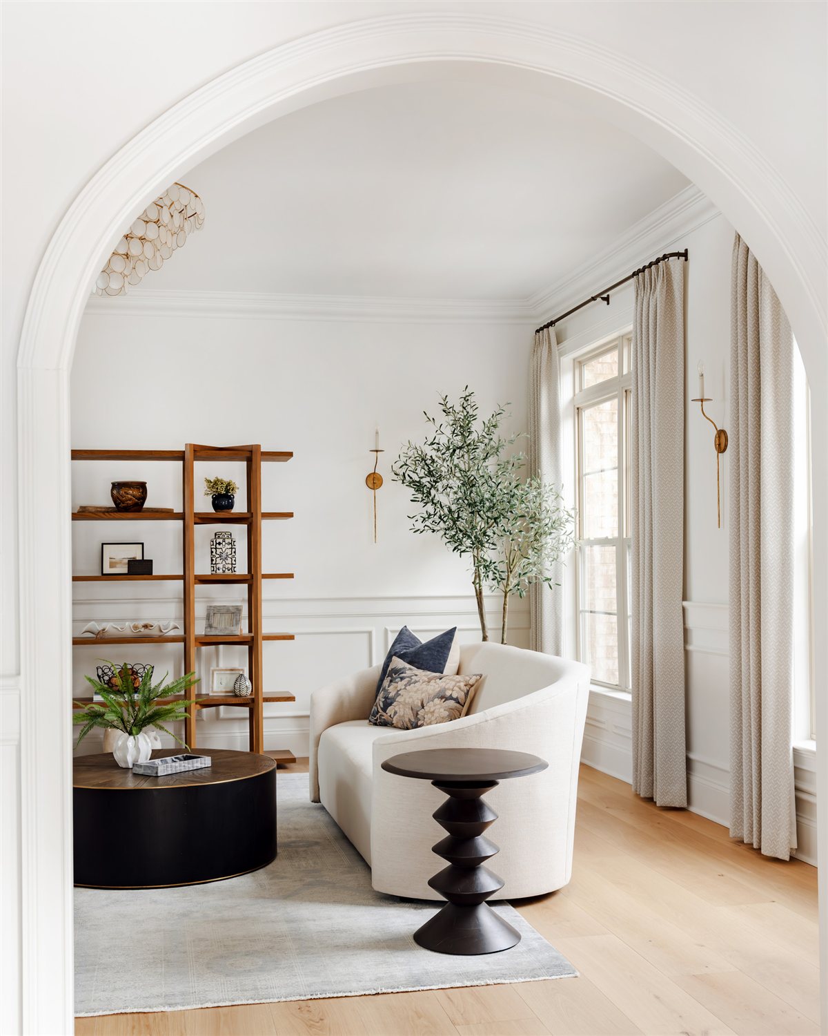 Sitting room with open shelving and swivel chairs, Waxhaw renovation